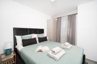 Postel nebo postele na pokoji v ubytování Apartments Palma Rabac