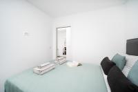 Postel nebo postele na pokoji v ubytování Apartments Palma Rabac