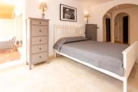 A bed or beds in a room at Ground Floor Apartment, Los Jardines de Santa Maria Elviria