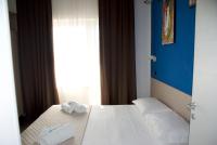 Posteľ alebo postele v izbe v ubytovaní Hotel Palazzo Caveja