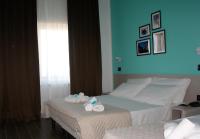 Posteľ alebo postele v izbe v ubytovaní Hotel Palazzo Caveja