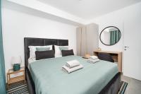 Postel nebo postele na pokoji v ubytování Apartments Palma Rabac