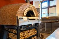 Kuchyň nebo kuchyňský kout v ubytování Rosso Aparthotel