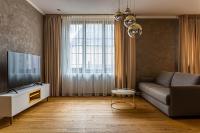 Televízia a/alebo spoločenská miestnosť v ubytovaní Rosso Aparthotel