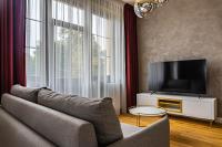 Televízia a/alebo spoločenská miestnosť v ubytovaní Rosso Aparthotel