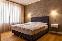 Posteľ alebo postele v izbe v ubytovaní Rosso Aparthotel