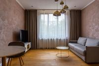 Televízia a/alebo spoločenská miestnosť v ubytovaní Rosso Aparthotel