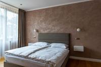Posteľ alebo postele v izbe v ubytovaní Rosso Aparthotel