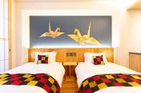 Hotel Kanazawa Zoushiにあるベッド