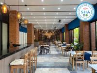 En restaurant eller et andet spisested på Jomtien Longstay Hotel - SHA Plus Certified
