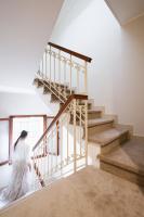 a woman walking down a staircase in a house at Hotel Do Pozzi in Venice