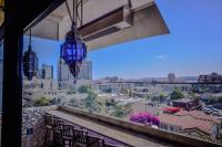 a view of a city from a balcony with chairs at Porto Vista Hotel In Little Italy in San Diego