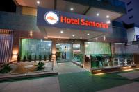 a hotel entrance with a hotel santorini sign at Hotel Santorini in Vila Velha