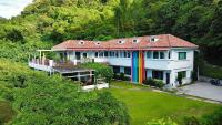 a large white house with a rainbow on it at Li Wu Zuo Cun B&amp;B in Chongde