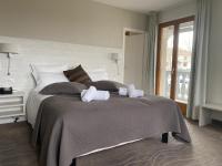 Ein Bett oder Betten in einem Zimmer der Unterkunft Auberge de Confignon