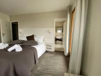 Ein Bett oder Betten in einem Zimmer der Unterkunft Auberge de Confignon