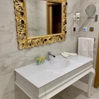Kúpeľňa v ubytovaní Rosso Aparthotel