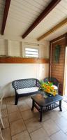 a living room with a couch and a table at Maison de 3 chambres avec jardin clos et wifi a Pointe Noire in Pointe-Noire