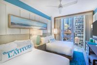Ein Bett oder Betten in einem Zimmer der Unterkunft Margaritaville Resort Times Square