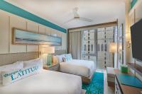 Ein Bett oder Betten in einem Zimmer der Unterkunft Margaritaville Resort Times Square