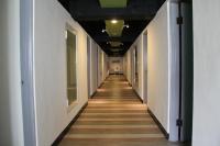 a hallway of an office building with a long corridor at Hwa Hong Hotel in Kaohsiung