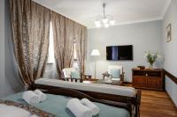 Łóżko lub łóżka w pokoju w obiekcie Baron Boutique Hotel