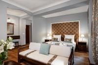Łóżko lub łóżka w pokoju w obiekcie Baron Boutique Hotel