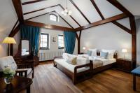 Łóżko lub łóżka w pokoju w obiekcie Baron Boutique Hotel