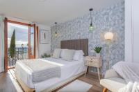 A bed or beds in a room at Genteel Home Mirador de San Cristóbal