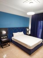 Posteľ alebo postele v izbe v ubytovaní Perinthos Hotel
