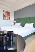 Posteľ alebo postele v izbe v ubytovaní Perinthos Hotel