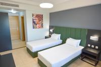 Posteľ alebo postele v izbe v ubytovaní Perinthos Hotel