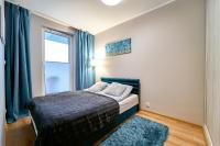 Posteľ alebo postele v izbe v ubytovaní LAGUNA Apartament Polanica Residence 12