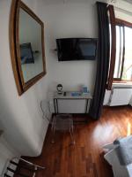 A television and/or entertainment centre at EMI's Guest House