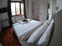 A bed or beds in a room at EMI's Guest House