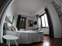 A bed or beds in a room at EMI's Guest House