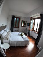 A bed or beds in a room at EMI's Guest House