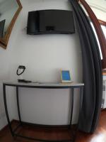A television and/or entertainment centre at EMI's Guest House