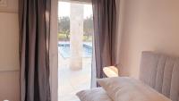 Postel nebo postele na pokoji v ubytování Ferienhaus Rovinj mit Pool