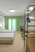 Posteľ alebo postele v izbe v ubytovaní Perinthos Hotel