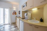 a bathroom with a sink and a counter with a computer on it at La Casa de la Favorita in Tarifa