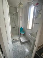 a bathroom with a shower and a toilet and a sink at RENT APPART - Colombes in Colombes