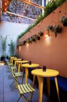 a row of tables and chairs in a restaurant at Hotel Alameda, Highline in New York