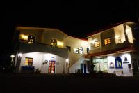 a large white building with lights at night at Sine Ya Hostel in Hengchun South Gate