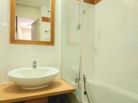 a white bathroom with a sink and a shower at Appartement La Plagne-Tarentaise, 1 pièce, 4 personnes - FR-1-351-146 in La Plagne Tarentaise