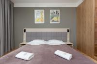 Postel nebo postele na pokoji v ubytování Business Studio Apartments Wolska by Noclegi Renters