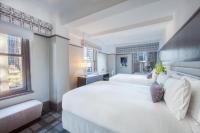 Ein Bett oder Betten in einem Zimmer der Unterkunft Park Central