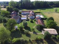 an aerial view of a large house with a yard at Gites Le Clos de Saires in Saires