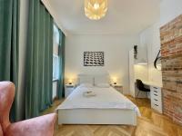 Łóżko lub łóżka w pokoju w obiekcie Chili Apartment
