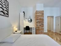 Łóżko lub łóżka w pokoju w obiekcie Chili Apartment